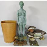 A composite nude study of a woman, a wooden Mandarin duck (as found), a set of brass postal