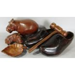 Collection of treen including hippos, large wooden clogs, large gavel, coasters, fruit bowl, etc,