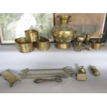 A collection of brass ware including three concentric oval planters, a miniature watering can, a