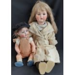 Two early 20th century German dolls both with Simon & Halbig head with visible cracks/damage; larger