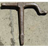 An old cast iron stake anvil with single shaped arm and square cut outs, 57 cm wide x 52 cm high