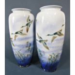 A pair of large Falcon ware ceramic vases decorated with mallards in flight in shades of blue and