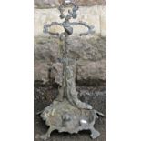 A cast metal umbrella stand with recumbent hound, game, hunting horn and naturalistic detail, 56