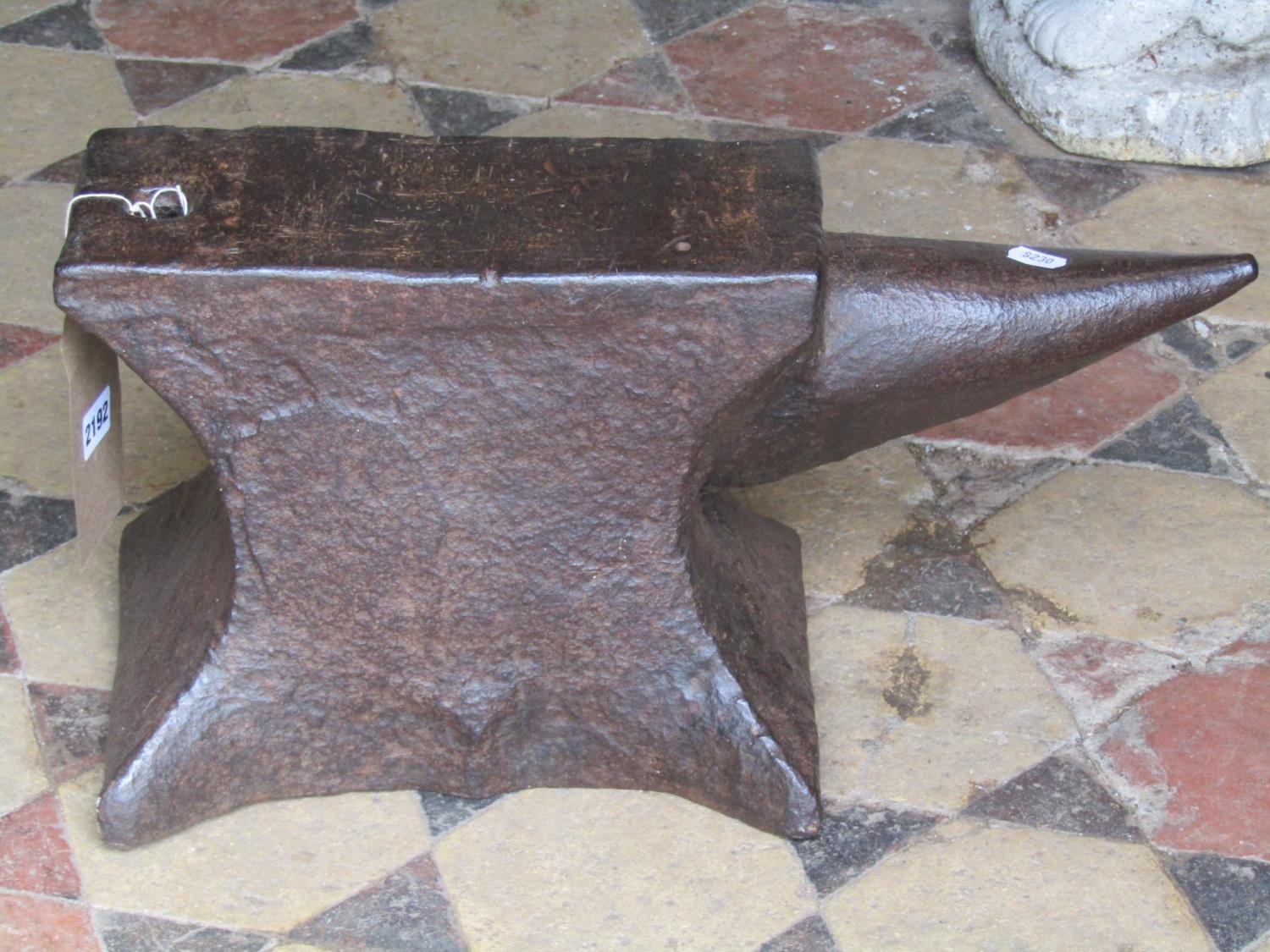 An old cast iron anvil, 50 cm long x 25 cm high