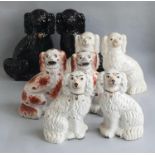 Four pairs of ceramic Staffordshire spaniels height range 26 - 34cm