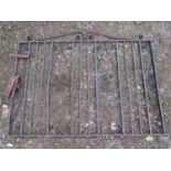 A low ironwork entrance gate with simple scroll work detail, 140 cm wide x 102 cm high, together