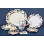 A large mixed collection of tea and dinnerwares in both the Booths Floradora and Royal Cauldron