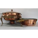 A copper tripod casserole with burner, a copper saucepan, a large copper Middle Eastern tray and two