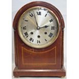 An inlaid Edwardian mahogany mantle clock with string inlaid detail and three train striking