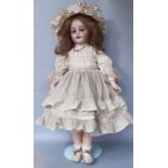 Late 19th/ early 20th century bisque head child doll by Simon & Habig, mould 1039, with voice,