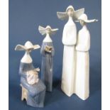 Three Lladro figures of nuns in various poses, one in white glaze depicting two nuns, their arms