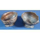 A pair of bronze open dishes in the form of open conch shells, 10cm max
