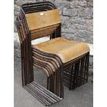 A set of eight vintage tubular steel framed and plywood stacking Municipal chairs