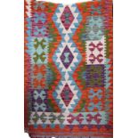 A Khobi Kelim runner with brightly coloured geometric pattern, 250cm x 81cm