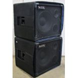 A pair of Vanderkley amp speakers with outer wraps, complete with telescopic tripod stands