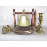 An early 20th century brass bell gong mounted on a mahogany stand, 33cm wide x 32cm high, a pair