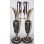 A pair of decorative Renaissance bronze ewers with gilt highlights and engraved classical figures.