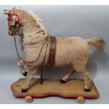 Large pull along / ride on horse 'Starlight' of wooden construction covered in hide, with leather