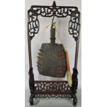 A Chinese Zhong gong, with spike and studded detail bearing an inscription to the middle hung from