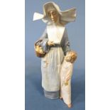 A Lladro glazed figure of a nun with a small child, 41cm tall approx, with box