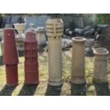 Five reclaimed chimney pots of varying size and design including three buff coloured examples, the