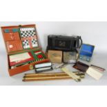A travel games case with Chess, draughts etc, a sovereign balance, two cigarette cases and a novelty