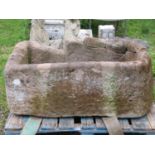 A substantial weathered natural stone rectangular trough with single D end 112 cm long x 64 cm