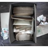 A box containing a large quantity of loose unsorted stamps. [1]