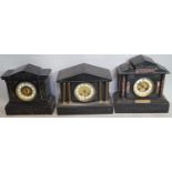 Three Victorian black slate mantle clocks of architectural form all with eight day striking