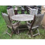 An Alexander Rose weathered teak folding garden table with concentric circular slatted top, 130 cm