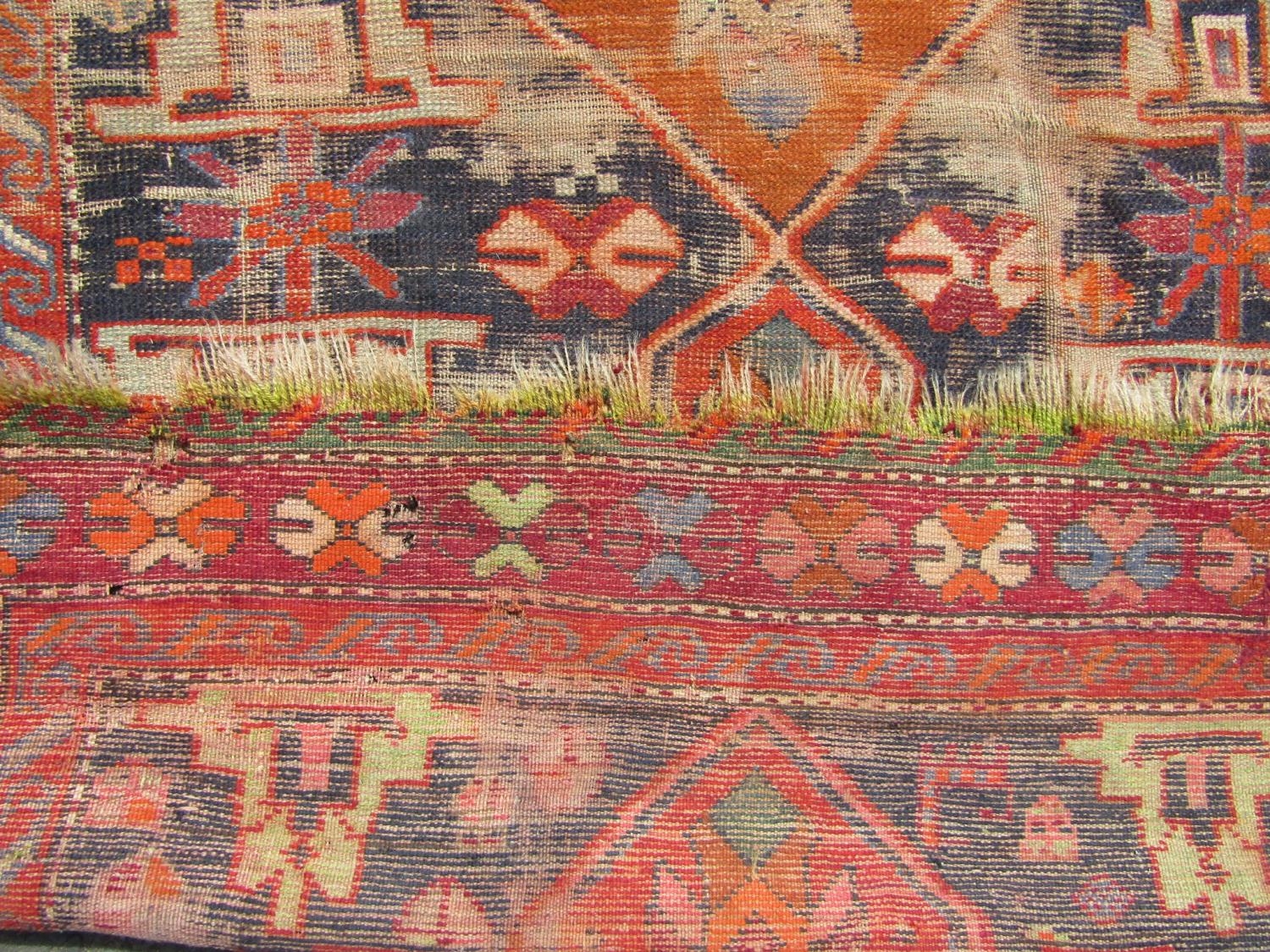 An old Persian rug with a central orange medallion,245cm x 120cm approx - Image 4 of 4
