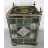 A Victorian multi coloured stained glass lantern with leaded panels and brass structure. (In need of