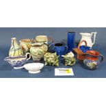 A collection of ceramics to include studio pottery jugs and tankard with leaf and scrolling