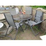 A weathered grey coated/painted light steel framed garden terrace table of circular form with