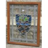 An Arts & Crafts style leaded light panel with shield shaped galleon and fish detail within a good