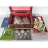 A 19th century rosewood box containing a collection of miscellaneous 20th century coinage and bank