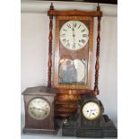 A Victorian black slate mantle clock, a further timber cased mantle clock and a late 19th century