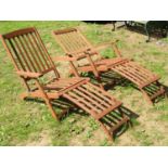 A pair of contemporary stained hardwood folding steamer type open armchairs with slatted seats,