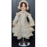 Early 20th century bisque head doll by Kammer & Rheinhardt (head by Simon & Halbig) with brown