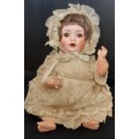 Small bisque head character doll 'Hanna' circa 1920 by Schoenau & Hoffmeister, with 5 piece bent