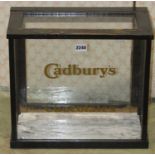 A vintage counter top Cadburys Chocolates shop display cabinet with stained oak frame 40 cm wide x