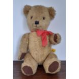 Vintage teddy bear by Dean's Gwentoy Group, with golden plush fur, stitched nose and mouth,