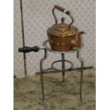 A 19th century polished steel kettle stand with turned ebonised handle, together with a copper