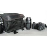 Photographic equipment including an Olympus OM 707 camera and an Olympus zoom lens in a grey Tek