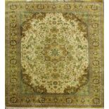 A large Belgian made Louis de Poortere Persian style carpet with an all over floral pattern on a