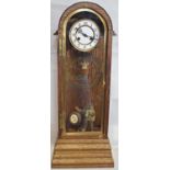 An oak cased clock with a 19th century eight day striking movement with later RAF commemorative
