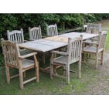 A good quality weathered hardwood extending garden table of rectangular form with slatted top and
