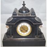 A Victorian black slate mantle clock of architectural form, with eight day movement