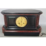 A substantial Victorian black slate and marble mantle clock, the engraved dial enclosing an eight