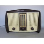 A G.E.C vintage plastic cased mono radio with central three frequency tuning panel, 36cm wide x 26cm